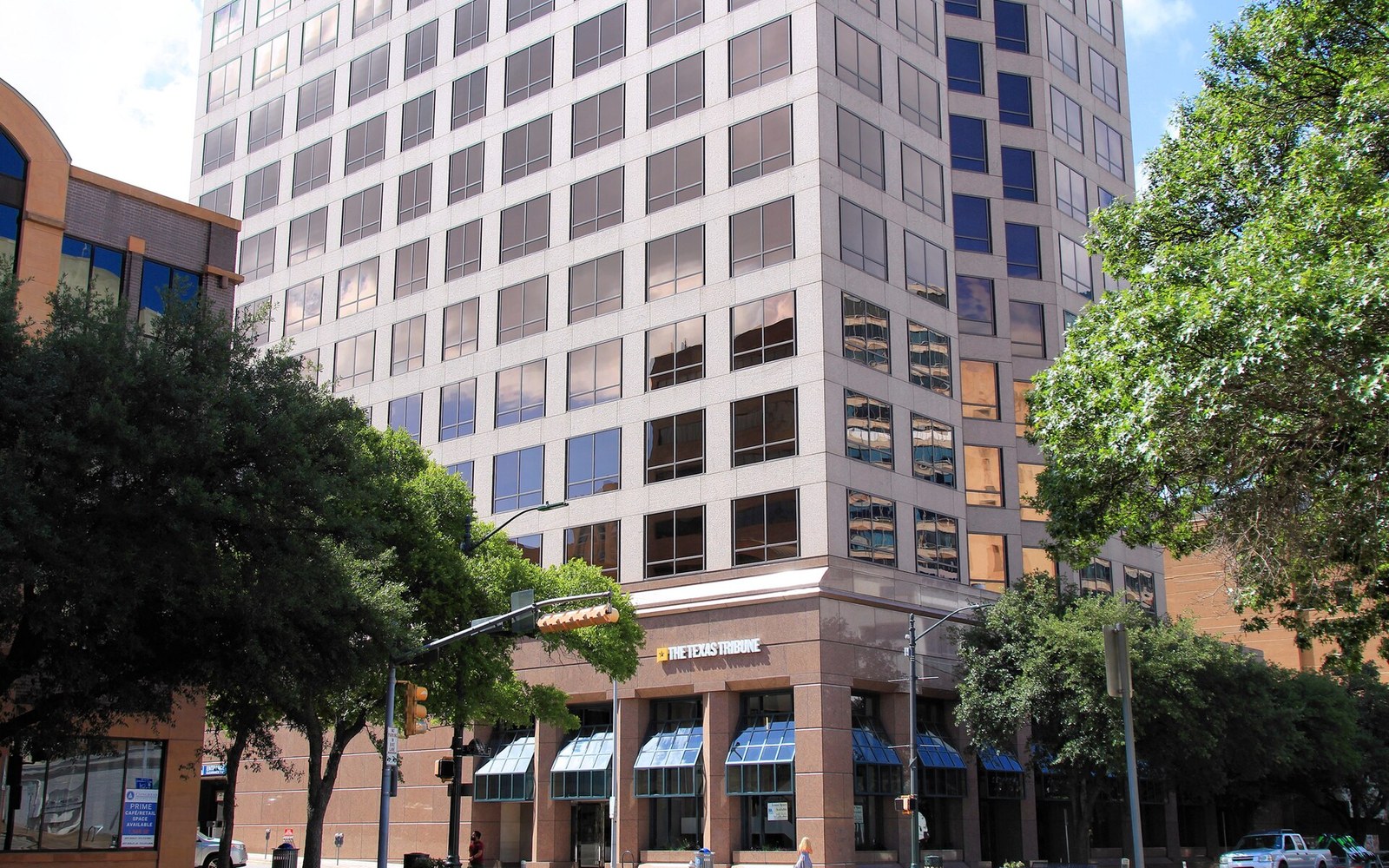 High-rise office building housing the Texas Tribune's street-level newsroom entrance
